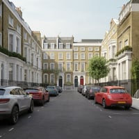 Cars parked along both sides of a typical London residential street